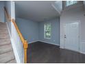 Inviting entryway features hardwood floors, a staircase with carpeted steps, and a view into an adjacent room at 1629 Jorrington Street St, Mount Pleasant, SC 29466