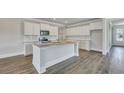Modern kitchen featuring stainless steel appliances, quartz countertops, and a kitchen island at 214 Bilge Rd, Ridgeville, SC 29472