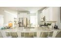 Spacious kitchen featuring granite countertops, stainless steel appliances, and ample seating at 214 Yalton St, Summerville, SC 29486