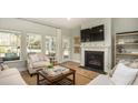 Inviting living room featuring a fireplace, large windows, and comfortable seating at 214 Yalton St, Summerville, SC 29486