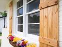 Close up of the custom shutters and flower box highlighting the home's attention to detail and charm at 2704 Orchid Ave, North Charleston, SC 29405