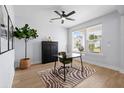 Bright home office with neutral walls, wood floors, and large windows providing ample natural light at 347 Ripple Park Dr, Summerville, SC 29486