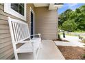 Inviting front porch with a white bench, a view of the front door, and a partial view of the street at 3789 Tupelo Branch Row, Mount Pleasant, SC 29429