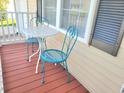 Cozy front porch with outdoor seating, perfect for relaxing and enjoying the neighborhood view at 4457 Rice Mill Dr, North Charleston, SC 29420