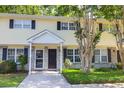 Charming townhome with a well-maintained lawn, brick facade, black shutters, and inviting entranceway at 507 Stinson Dr # 4G, Charleston, SC 29407