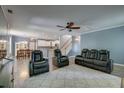 Open-concept living room flowing into the dining area and kitchen, perfect for modern living and entertaining at 5105 Parrum Ct, Summerville, SC 29485