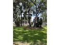 Traditional-style home surrounded by mature trees and lush greenery at 578 Island Walk East, Mount Pleasant, SC 29464