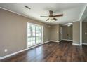 Bright living room with hardwood floors and a large window at 610 Old Golf Rd, Summerville, SC 29483