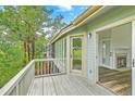 Spacious deck leading into a living room with a fireplace at 638 Harbor Creek Pl # 19, Charleston, SC 29412