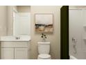 Bright bathroom with a white vanity, modern fixtures, and framed art at 639 Culpepper St, Summerville, SC 29486