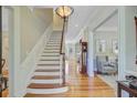 Spacious foyer with hardwood floors, staircase, and elegant trim details at 750 Navigators Run, Mount Pleasant, SC 29464