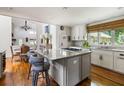 Bright kitchen with a large island, granite countertops, stainless steel appliances, and hardwood floors at 914 Red Coat Run, Mount Pleasant, SC 29464