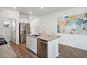 Well-equipped kitchen with stainless steel appliances, granite countertops, and a functional kitchen island at 1056 Tea Time Dr, Summerville, SC 29485