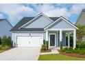 Beautiful single Gathering home with a landscaped yard, two-car garage, and covered front porch at 119 Pen Shell St, Summerville, SC 29485
