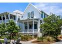 Charming two-story home boasting a welcoming porch and fresh landscaping at 1466 Mizzen Aly, Johns Island, SC 29455
