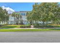 A nice view of the condo, highlighting the neat landscaping, blue sidings, and symmetrical design at 1723 Brittlebush Ln, Johns Island, SC 29455