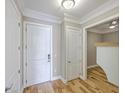 Bright hallway with wood floors, fresh paint, and elegant trim at 200 River Landing Dr # 307B, Charleston, SC 29492