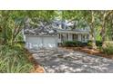 Charming home with an attached two-car garage and long driveway at 202 Woodbridge Dr, Summerville, SC 29486