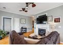 Cozy living room with fireplace, hardwood floors and neutral wall color at 2329 Tall Sail Dr # 704D, Charleston, SC 29414
