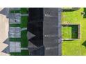 Aerial view of a townhome with a roof and a well-maintained yard at 282 Swallowtail Ln, Goose Creek, SC 29445