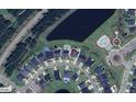 Community aerial view showcasing the neighborhood layout, amenities, and proximity to a lake at 316 Beachgrass Ln, Summerville, SC 29486