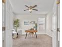 Bright home office featuring neutral walls, carpet floors, modern ceiling fan, and plenty of natural light at 316 Beachgrass Ln, Summerville, SC 29486