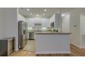 Modern kitchen with stainless steel appliances and white cabinetry at 4028 Babbitt St, Charleston, SC 29414