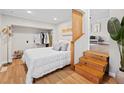Cozy bedroom featuring a comfortable bed, closet and convenient access to living area via steps at 5904 Oak Street, Hanahan, SC 29410