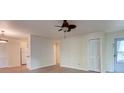 Open-concept living room with wood floors is attached to kitchen, offering easy access at 6275 Rolling Fork Rd # 401, North Charleston, SC 29406