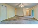 Bright living room with a ceiling fan and a view of the hallway and the front door at 6280 Rolling Fork Rd # 302, North Charleston, SC 29406