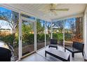 Relaxing screened porch with outdoor seating, ceiling fan and views of the backyard at 1005 Yellow Hawthorn Circle, Summerville, SC 29483