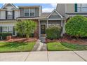Charming two-story townhome with well-manicured front yard and inviting entrance at 105 Brockman Way, Goose Creek, SC 29445