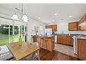 Eat-in kitchen with island and seating with sliding glass doors to patio at 105 Brockman Way, Goose Creek, SC 29445