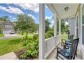 Inviting front porch with comfortable seating, offering serene views of the neighborhood at 109 Cypress Plantation Rd, Moncks Corner, SC 29461