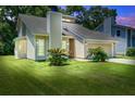 Charming single-Gathering home features a manicured lawn and attached two-car garage at 112 Lewisfield Dr, North Charleston, SC 29418