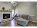 Relaxing living room featuring a decorative fireplace and a comfortable sectional sofa at 112 Lewisfield Dr, North Charleston, SC 29418