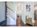 Inviting entryway with hardwood floors, staircase and neutral color palette at 1242 Schirmer St, Mount Pleasant, SC 29464