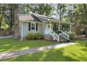 Lovely home with a welcoming front porch, brick chimney, green lawn, and a sidewalk leading to the entrance at 1337 Old Fort Rd, Moncks Corner, SC 29461
