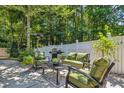 An outdoor patio with cushioned seating and a grill, perfect for entertaining in a private backyard at 1350 Water Edge Dr, Charleston, SC 29492