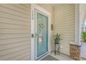 Inviting front entrance with a glass storm door, decorative wreath, and house number at 139 Gaslight Blvd, Summerville, SC 29483