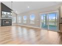 Bright living room featuring hardwood floors, a modern fireplace, and sliding doors to an outdoor patio at 240 Lucca Dr, Summerville, SC 29486