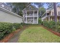Charming two-story home with a manicured yard and inviting curb appeal in lush surroundings at 3221 Johnstowne St, Johns Island, SC 29455