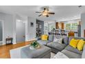 Comfortable living room featuring a gray sofa, decorative pillows, wood floors, and an open floor plan at 4060 Hartland St, Charleston, SC 29414
