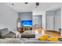 Inviting living room with a large sofa, neutral decor, and seamless transition to the dining area at 4060 Hartland St, Charleston, SC 29414