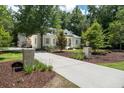 Beautiful home with a long driveway and landscaped yard, offering a sense of privacy and curb appeal at 441 Elfes Field Ln, Charleston, SC 29492