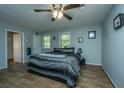 Comfortable bedroom with ample natural light, a ceiling fan, and neutral wall colors at 565 Estates Dr, Walterboro, SC 29488