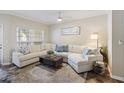 Comfortable living room area with large couch, wooden floors and a ceiling fan at 700 Daniel Ellis Dr # 5103, James Island, SC 29412