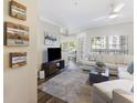 Bright living room with wood floors, comfortable seating, and a view to the outside at 700 Daniel Ellis Dr # 5103, James Island, SC 29412