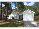 Charming single-story home featuring a well-manicured lawn and attached one car garage in a desirable neighborhood at 714 Alwyn Blvd, Summerville, SC 29485
