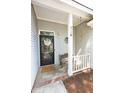 Inviting front porch features a charming bench, decorative details, and a welcoming entrance for guests at 714 Alwyn Blvd, Summerville, SC 29485